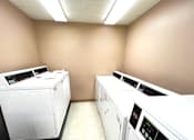 Thumbnail 11 of 17 - On-site laundry facility at Kentwood Square Apartments.