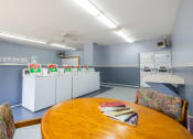 Thumbnail 7 of 23 - Communal laundry facility at Woodbridge Apartments
