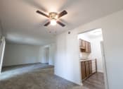 Thumbnail 10 of 12 - Open living and dining space with kitchen in a 2 Bedroom Apartment  at Woodlake Apartments