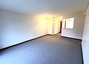Thumbnail 2 of 17 - Open living and dining area in a one-bedroom, one-bathroom apartment at Kentwood Square Apartments.