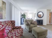 Thumbnail 17 of 23 - Living and dining room with patio access in the 1 bedroom apartment  at Woodbridge Apartments