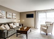 Thumbnail 4 of 27 - Living space with sliding glass door to balcony or patio at Archer's Pointe.