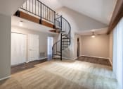 Thumbnail 31 of 63 - One-Bedroom Apartment Living Space with Loft Access at Woodbridge Apartments Bloomington