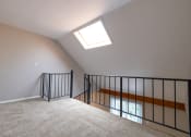 Thumbnail 32 of 63 - An Open Loft Space in the One Bedroom with Loft Apartment at Woodbridge Apartments Bloomington