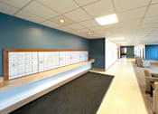 Thumbnail 9 of 17 - Mail room with lockers at Kentwood Square Apartments.