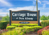 Thumbnail 13 of 13 - Monument sign for Carriage House Apartments in New Albany, prominently displaying the community's name at the entrance.