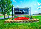 Thumbnail 15 of 15 - Monument sign at the entrance of Wesley Park Apartments, displaying the community name.