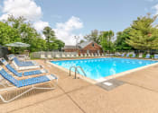 Thumbnail 1 of 21 - Outdoor swimming pool with seating at Ashley Pointe Apartments