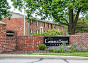 Thumbnail 1 of 15 - A brick wall with a sign that says Cambridge Square Apartments.