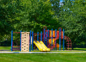 Thumbnail 2 of 16 - Playground at Cambridge Square Apartments in Greenwood, equipped with vibrant play structures.