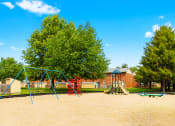 Thumbnail 11 of 18 - Playground at Briarwood Apartments in Lafayette, featuring colorful play equipment for children to enjoy.