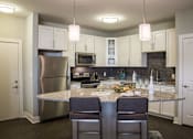 Thumbnail 9 of 41 - Emerald Style Floorplan Kitchen at Quarry at River North Apartments, Indianapolis, 46240