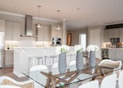 Thumbnail 15 of 41 - Luxury Penthouse Dining Room in Open Concept Living Space at Quarry at River North Apartments, Indianapolis, IN 46240