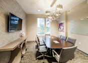 Thumbnail 26 of 41 - Interactive Social Space with USB Charging Stations and Television at Quarry at River North Apartments, Indianapolis