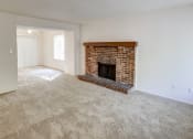 Thumbnail 23 of 25 - Townhome Living Room with a fireplace at The Woods of Eagle Creek