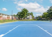 Thumbnail 16 of 63 - Outdoor basketball court at Woodbridge Apartments Bloomington