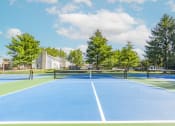 Thumbnail 15 of 63 - Tennis Courts at Woodbridge Bloomington Apartments