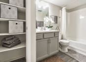 Thumbnail 17 of 39 - Bathroom with additional storage at Woods of Fairfax