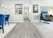 Thumbnail 5 of 39 - Living room, dining room, and hallway merge into a large open living space at Woods of Fairfax.