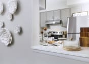 Thumbnail 4 of 39 - Kitchen with a pony wall and counter space at Woods of Fairfax.