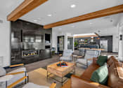 Thumbnail 17 of 37 - Modern living room with fireplace and wood beams at The Lyric Apartments, Washington, 98102