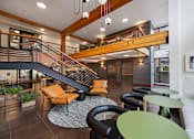 Thumbnail 11 of 37 - Modern lobby with staircase and seating areas at The Lyric Apartments, Seattle, WA 98102