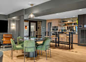 Thumbnail 20 of 37 - Open dining and kitchen space with modern furnishings at The Lyric Apartments, Seattle, Washington