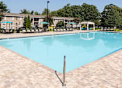 Thumbnail 12 of 29 - A large rectangular pool with a black pole in the middle of it.