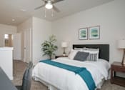 Thumbnail 10 of 21 - Spacious bedroom with ceiling fan and artwork at Liberty Point Apartments, Utah, 84020