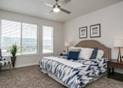 Thumbnail 9 of 21 - Spacious master bedroom with large windows at Liberty Point Apartments, Draper