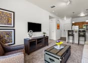 Thumbnail 7 of 34 - Open concept living room and kitchen area at Liberty Gateway Apartments, Utah