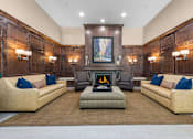 Thumbnail 27 of 34 - Lobby lounge with fireplace and wood paneling at Liberty Gateway Apartments, Salt Lake City, Utah