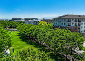 Thumbnail 29 of 34 - Courtyard with green space and mature trees at Liberty Gateway Apartments, Salt Lake City