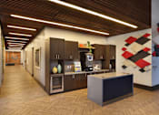 Thumbnail 40 of 41 - A modern kitchen with wooden floors and cabinets.