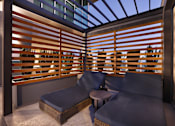Thumbnail 30 of 41 - A modern outdoor seating area with a wooden slatted wall and a glass ceiling.