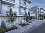 Thumbnail 2 of 18 - sidewalk and trees in front of it at Liberty Square Apartments - Saltlake City, UT Apartments, Apartments, Saltlake City, UT