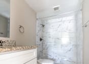 Thumbnail 12 of 19 - an image of a bathroom with a toilet and a shower at Palm Cove Apartments, Daytona Beach, 32114