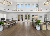 Thumbnail 18 of 29 - the living room has a large open floorplan with wood floors and white walls