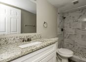 Thumbnail 11 of 19 - a bathroom with a sink and a toilet and a shower at Palm Cove Apartments, Daytona Beach, FL 32114