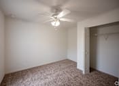Thumbnail 11 of 14 - large bedroom with a ceiling fan and walk-in closet