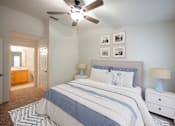 Thumbnail 8 of 14 - a bedroom with a bed and a ceiling fan