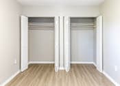 Thumbnail 6 of 15 - an empty bedroom with two closets at Lakeside @ Biscayne Gardens,North Miami, FL