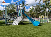 Thumbnail 23 of 29 - a playground with a slide and a swing set