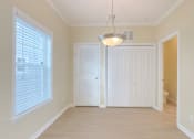 Thumbnail 10 of 24 - A white door is in the middle of a room.