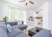 Thumbnail 5 of 29 - a living room with a couch and a table