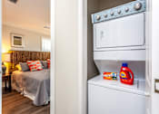 Thumbnail 9 of 20 - A white oven is open and a bottle of bounce back and a box of bounce it are on the shelf.