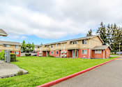 Thumbnail 1 of 17 - Apartment complex with a red curb in front.