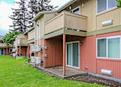 Thumbnail 16 of 17 - A building with a red and beige exterior.