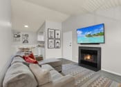 Thumbnail 1 of 18 - a large vaulted ceiling living room with a fire place and virtual furnishings at Rock Creek