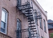 Thumbnail 12 of 12 - a fire escape on the side of a brick building